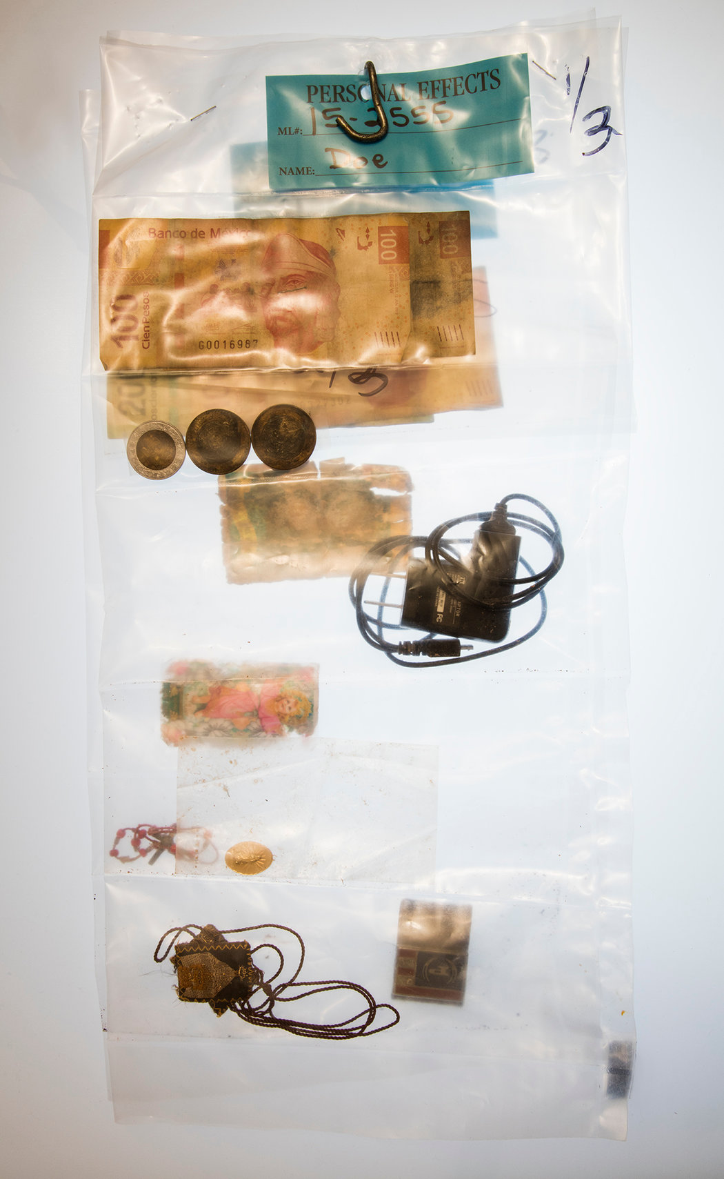 “John Doe, Artifact #6” (2016), by Richard Barnes. These are personal effects found on the bodies of migrants who had died in the Sonoran desert on the United States side of the border.