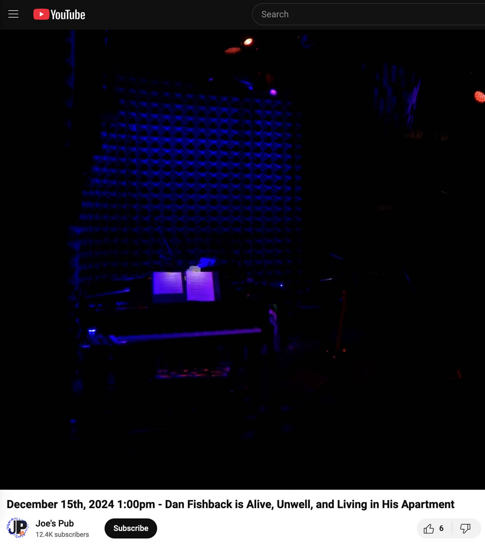 an empty stage at Joe's Pub with lit piano
